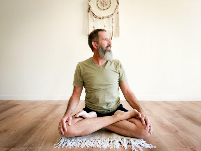 Yoga and Recovery image of James sitting in lotus pose